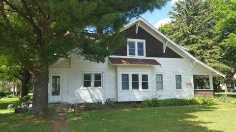 rear view of house with a lawn