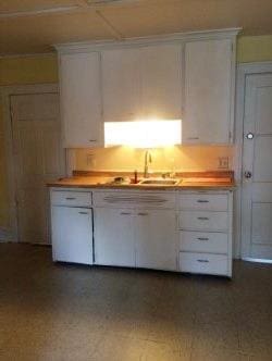 kitchen with sink and white cabinets