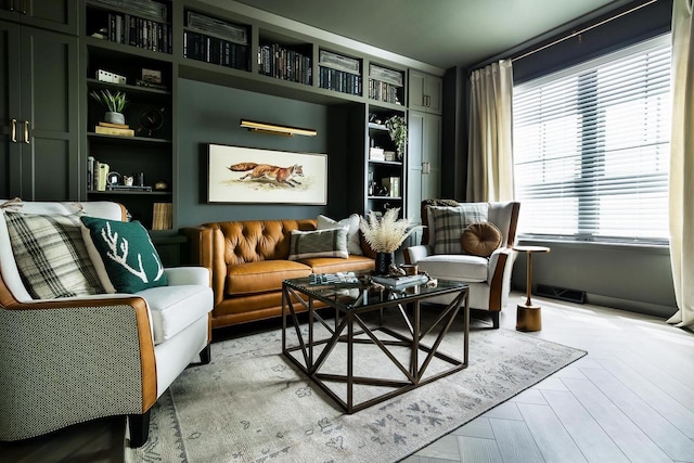 sitting room featuring light parquet flooring