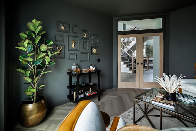 entryway with parquet floors and french doors