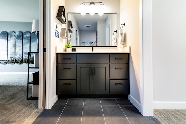 bathroom featuring tile patterned floors and vanity