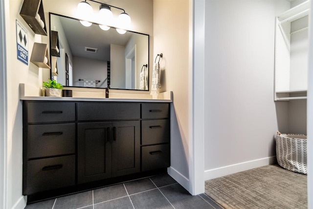 bathroom featuring tile patterned floors and vanity