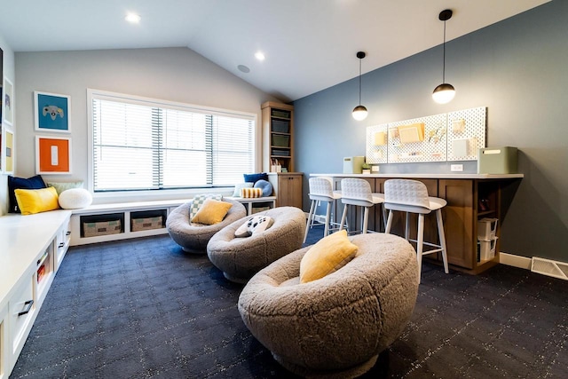 recreation room with lofted ceiling and bar