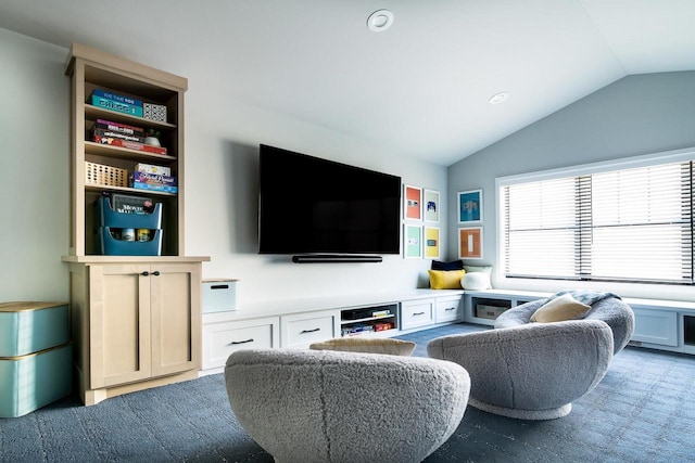 living room featuring lofted ceiling