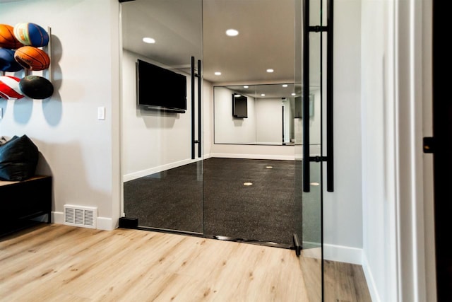 hall featuring wood-type flooring