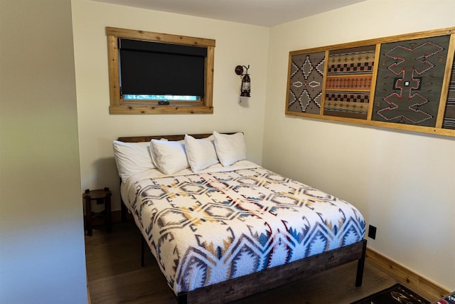 bedroom featuring dark hardwood / wood-style floors