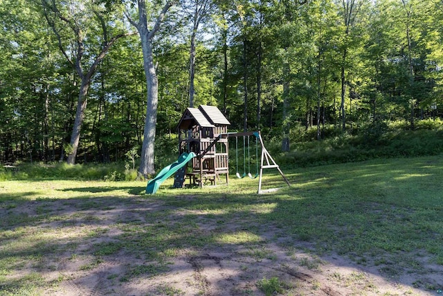 view of jungle gym featuring a lawn