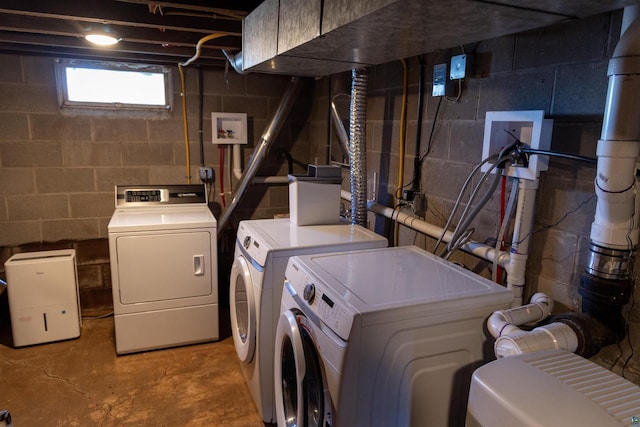 laundry area with separate washer and dryer