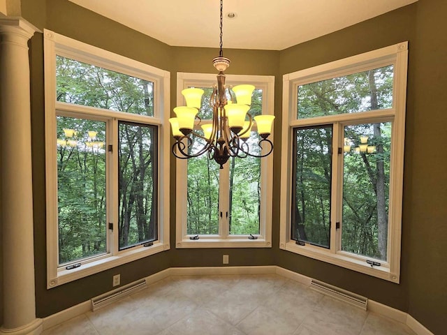 unfurnished dining area featuring light tile patterned floors, a notable chandelier, and plenty of natural light