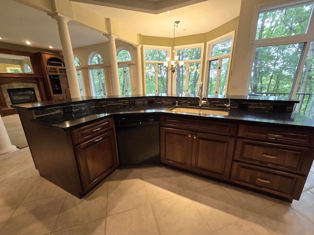 kitchen with sink, decorative light fixtures, light tile patterned floors, black dishwasher, and decorative columns