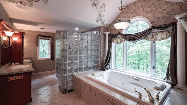 bathroom featuring tile patterned floors, vanity, independent shower and bath, and lofted ceiling