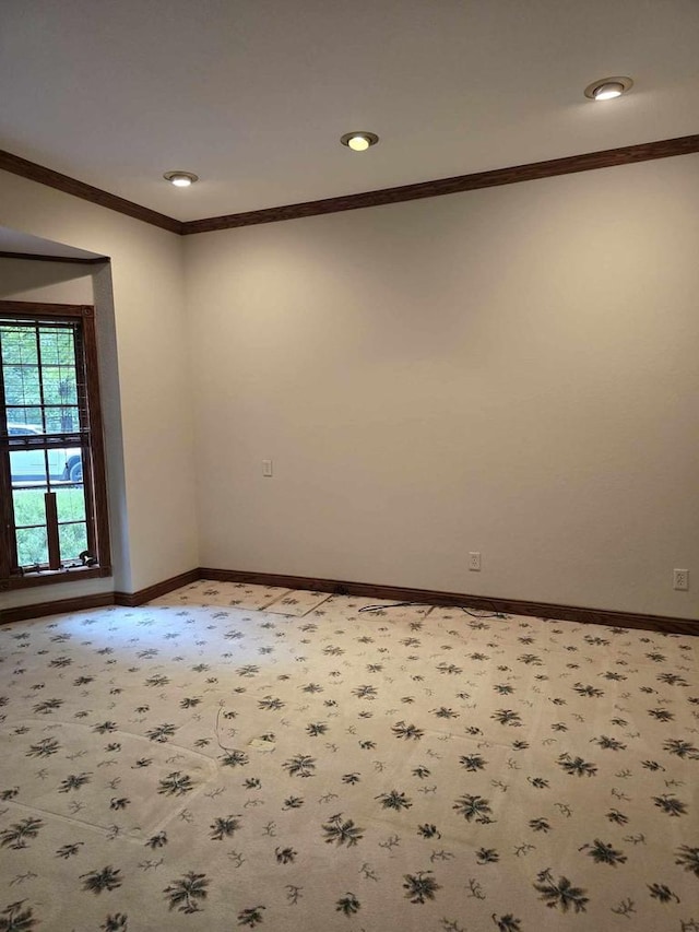 spare room with ornamental molding