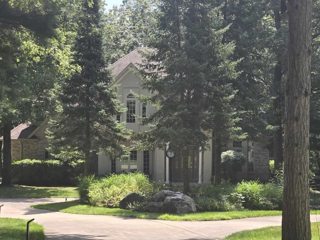 view of property hidden behind natural elements