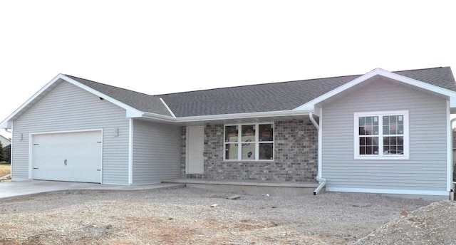 ranch-style home featuring a garage