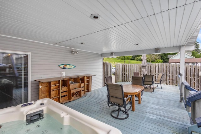 wooden terrace featuring an outdoor hot tub