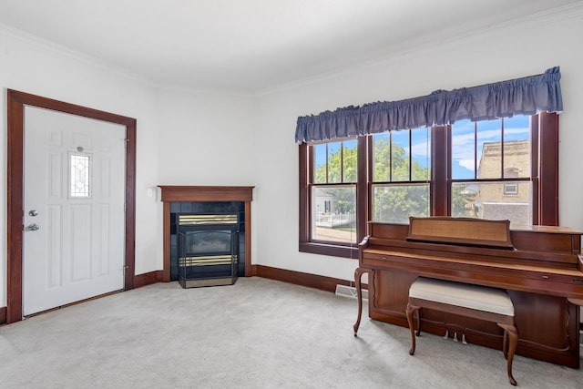 miscellaneous room with light carpet and ornamental molding