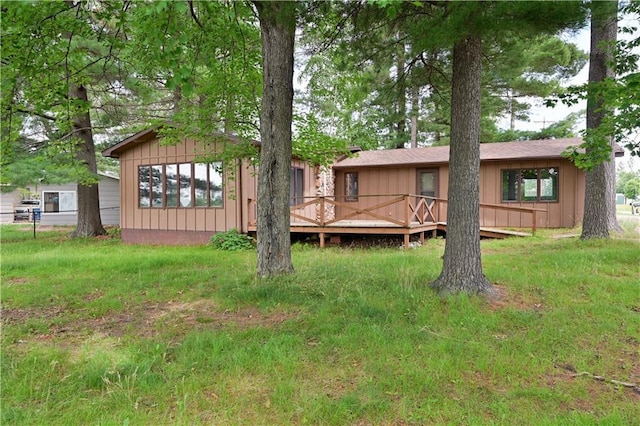 rear view of house with a wooden deck