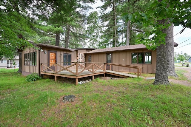 back of house with a wooden deck