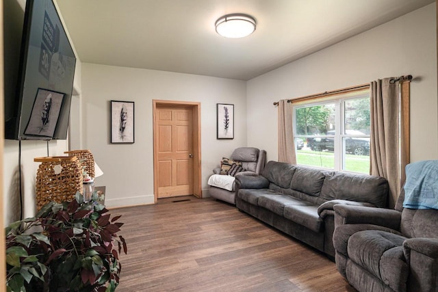 living room with dark wood-type flooring