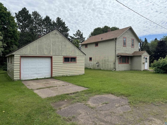 garage featuring a lawn