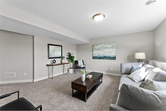 living room featuring a textured ceiling and carpet floors