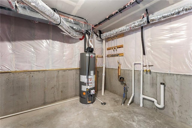 utility room featuring gas water heater