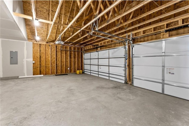 garage featuring electric panel and a garage door opener