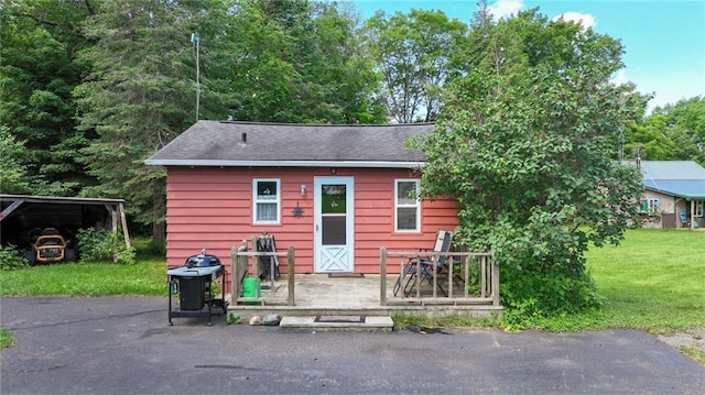 exterior space with a yard and a carport