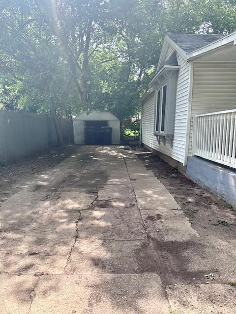 view of property exterior with a shed