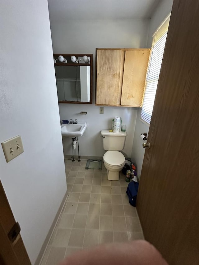 bathroom with sink and toilet