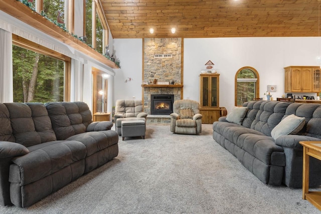 living room with carpet floors, a stone fireplace, high vaulted ceiling, and wooden ceiling