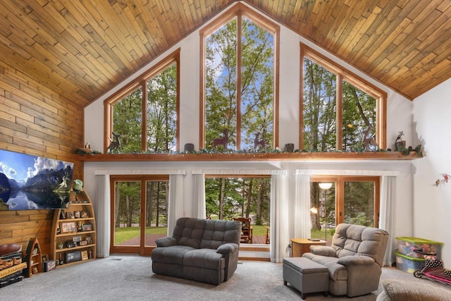 living room with carpet flooring, wood ceiling, and high vaulted ceiling