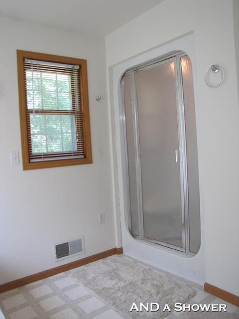 bathroom featuring an enclosed shower