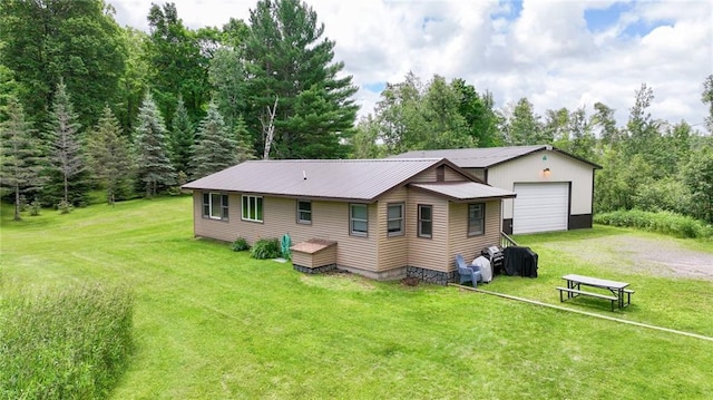 back of house with a lawn