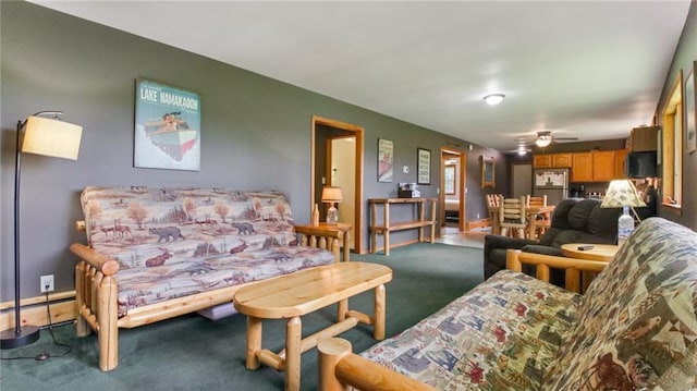 living room with carpet flooring and ceiling fan