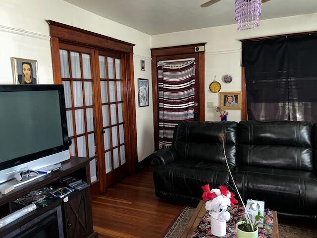 living room featuring french doors, ceiling fan, and dark hardwood / wood-style floors