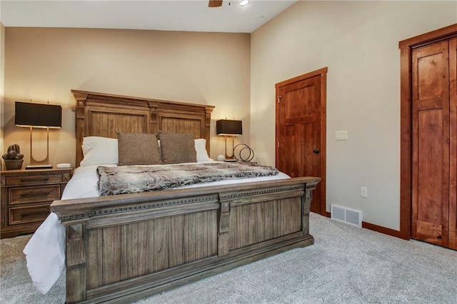 carpeted bedroom featuring vaulted ceiling