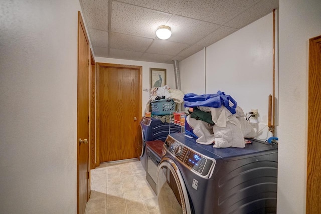 laundry room with washing machine and dryer