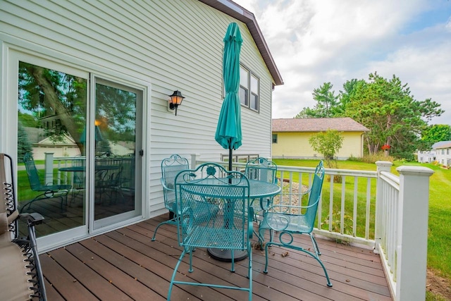 deck featuring a lawn