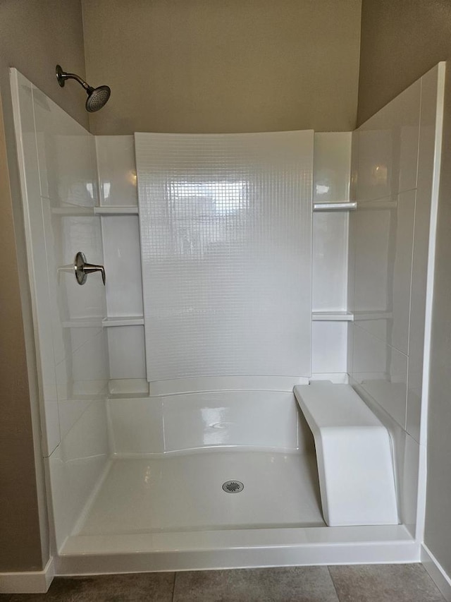 bathroom featuring tile patterned flooring and a shower