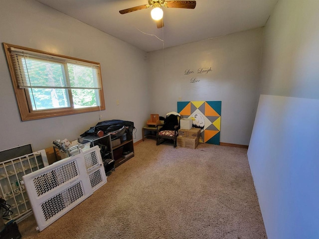 misc room with ceiling fan and carpet floors