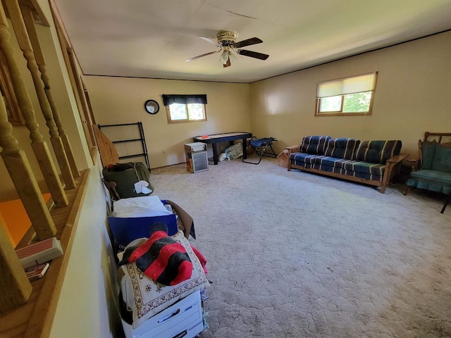 rec room with ceiling fan and carpet