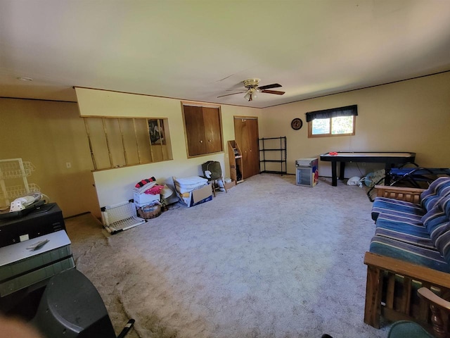 living room with carpet and ceiling fan