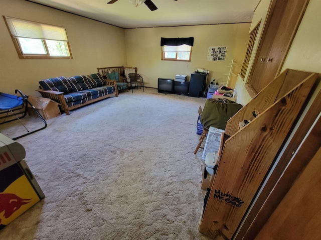 living room featuring carpet and ceiling fan