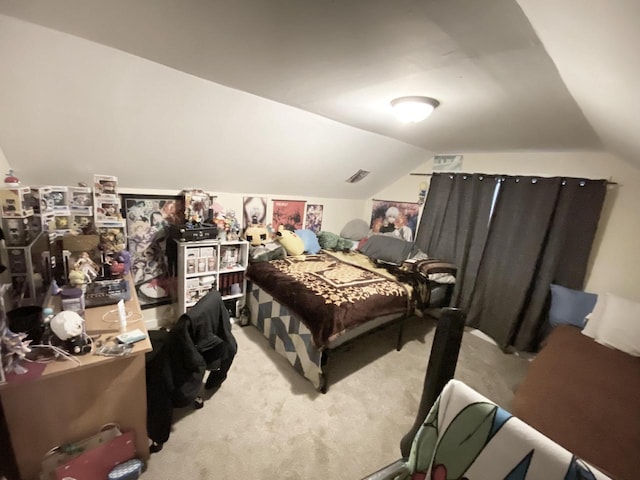 carpeted bedroom with vaulted ceiling