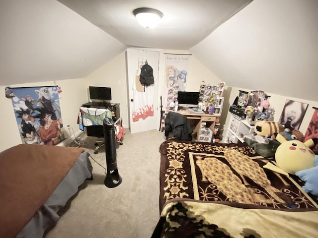 carpeted bedroom with vaulted ceiling