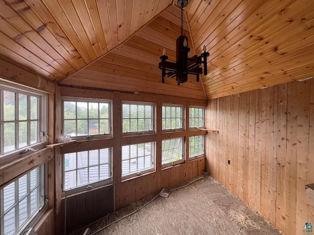 unfurnished sunroom featuring vaulted ceiling and wood ceiling