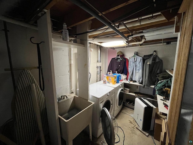 washroom featuring sink and independent washer and dryer