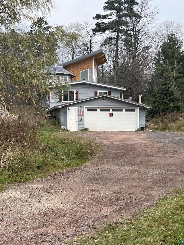 view of front of property with a garage