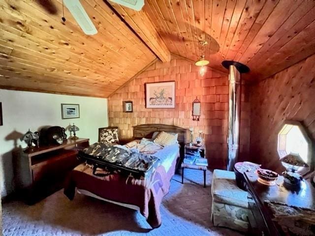 bedroom with vaulted ceiling with beams and wood ceiling